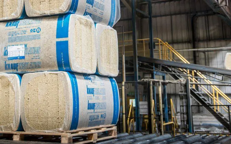 Knauf insulation boards on a pallet in a warehouse