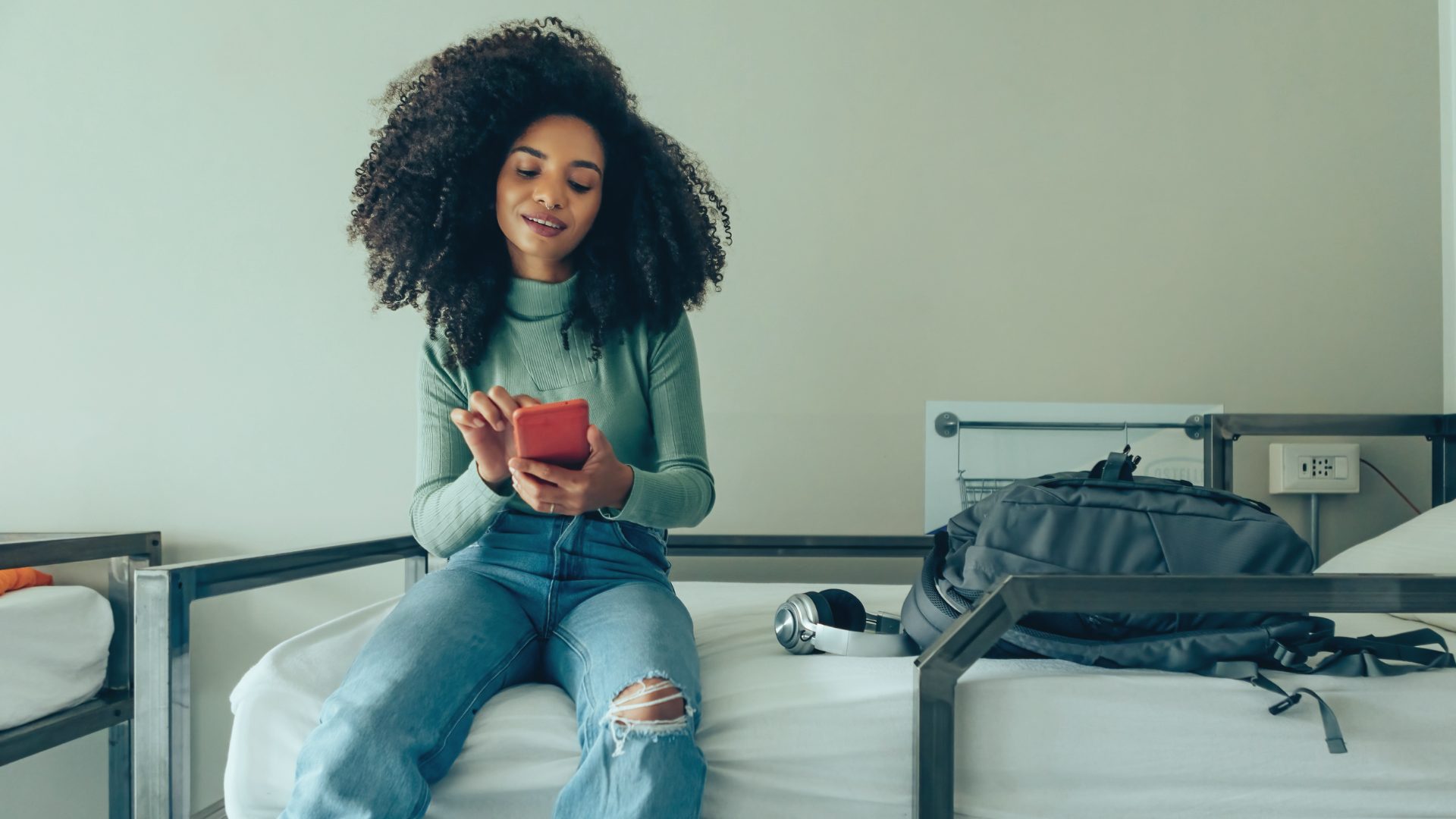 Woman using phone to make a purchase