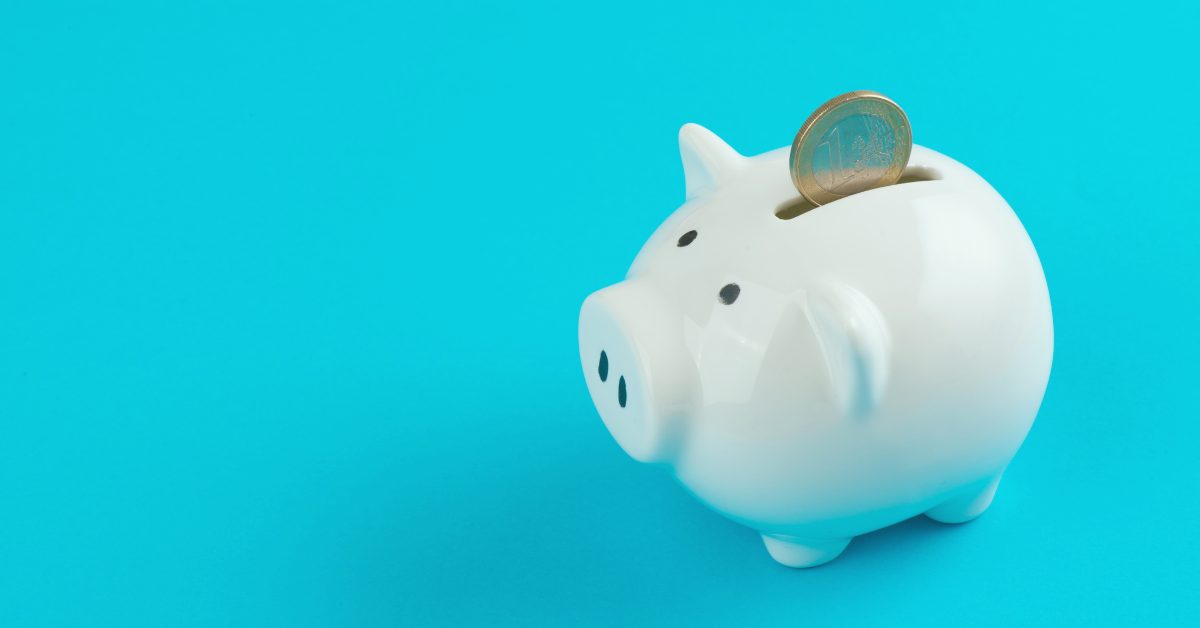 Piggybank on a blue background indicating "Saving Money"